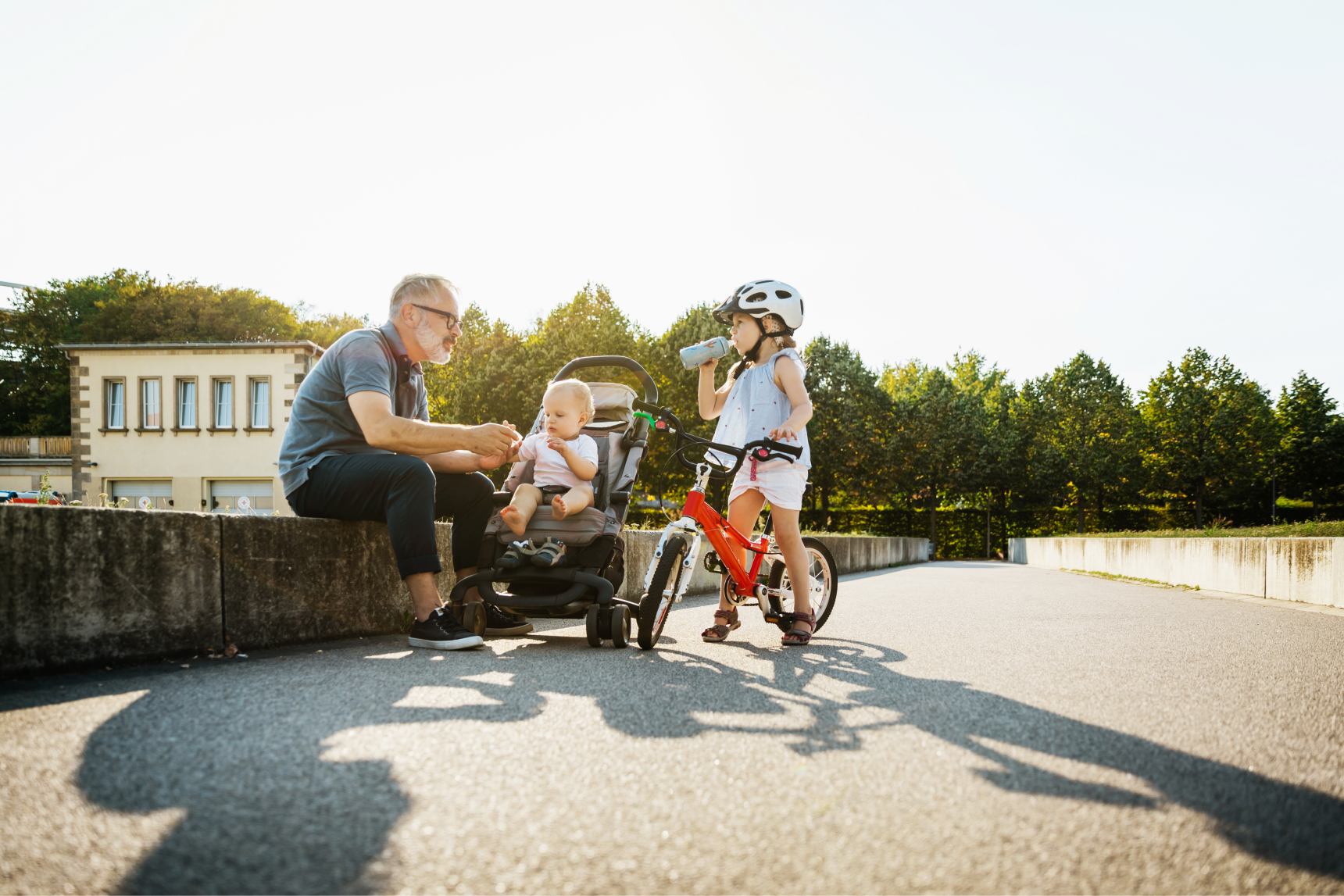 A grandfather and his two grandchildren enjoying the day